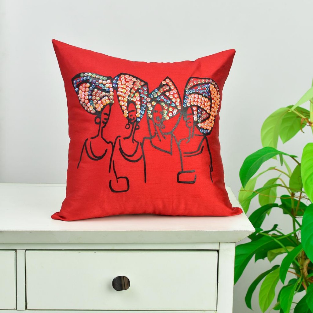 Tayo Shonekan of Aimas makes beaded throwpillows that features the African woman in all her glory